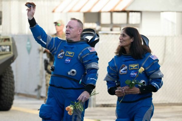 NASA astronauts Butch Wilmore, left, and Suni Williams, wearing Boeing spacesuits, are seen as they prepare to depart the Neil A. Armstrong Operations and Checkout Building for Launch Complex 41 on Cape Canaveral Space Force Station to board the Boeing CST-100 Starliner spacecraft for the Crew Flight Test launch, Wednesday, June 5, 2024, at NASA’s Kennedy Space Center in Florida. NASA’s Boeing Crew Flight Test is the first launch with astronauts of the Boeing CFT-100 spacecraft and United Launch Alliance Atlas V rocket to the International Space Station as part of the agency’s Commercial Crew Program. The flight test, targeted for launch at 10:52 a.m. EDT, serves as an end-to-end demonstration of Boeing’s crew transportation system and will carry NASA astronauts Butch Wilmore and Suni Williams to and from the orbiting laboratory. Photo Credit: (NASA/Joel Kowsky)