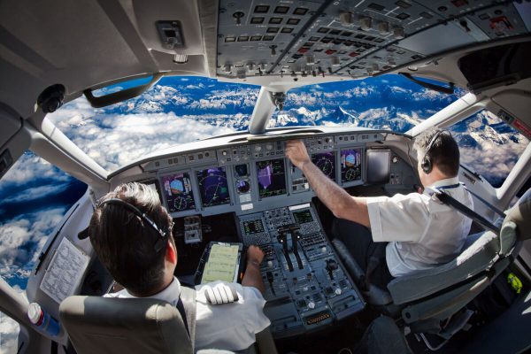 Cockpit,Of,The,Modern,Passenger,Aircraft,In,Flight.,Pilots,Fly