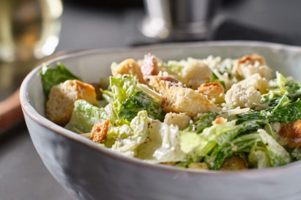 Fresh,Caesar,Salad,With,Croutons,And,Parmasan,Cheese,In,Bowl