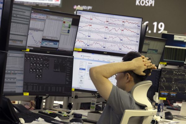 epa11517738 A South Korean dealer works in front of monitors at the Hana Bank in Seoul, South Korea, 02 August 2024. The benchmark South Korea Composite Stock Price Index (KOSPI) plummeted 101.49 points, or 3.65 percent, closing at 2,676.19 on 02 August 2024, following an overnight dive on Wall Street due to investors' recession fears.  EPA/JEON HEON-KYUN